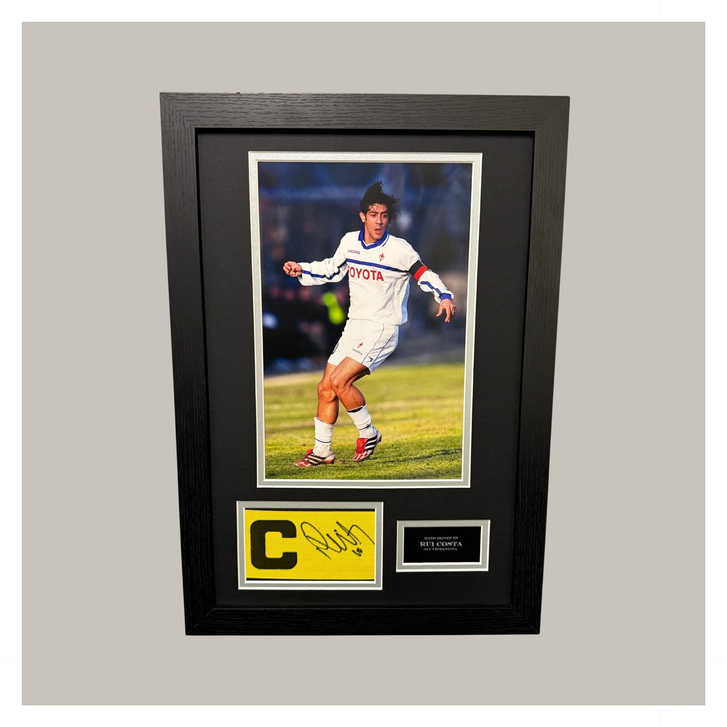 HAND SIGNED RUI COSTA CAPTAINS ARMBAND MOUNTED AND FRAMED.