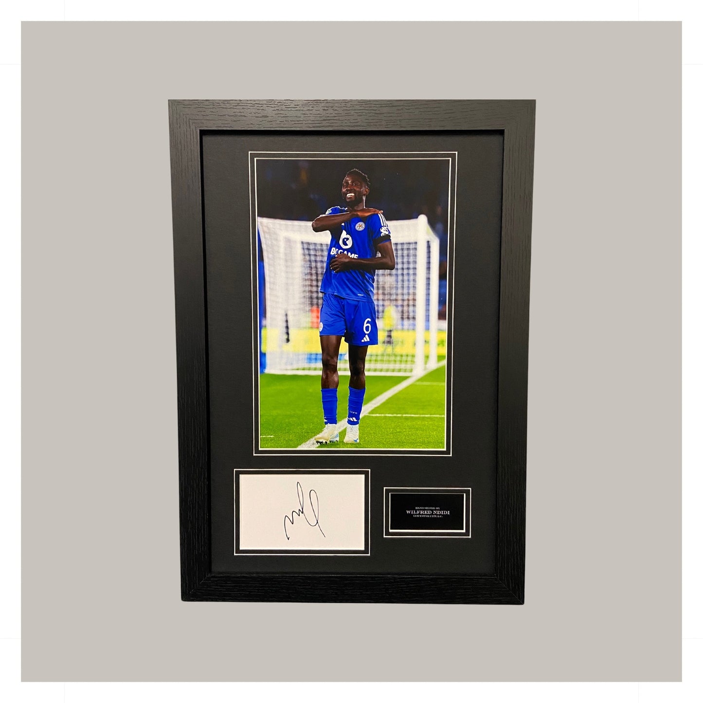 WILFRED NDIDI SIGNED MOUNTED DISPLAY