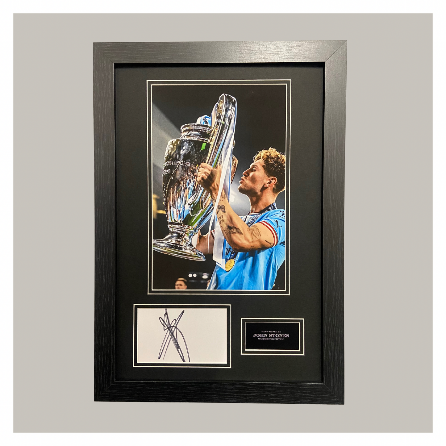 JOHN STONES HAND SIGNED CHAMPIONS LEAGUE DISPLAY